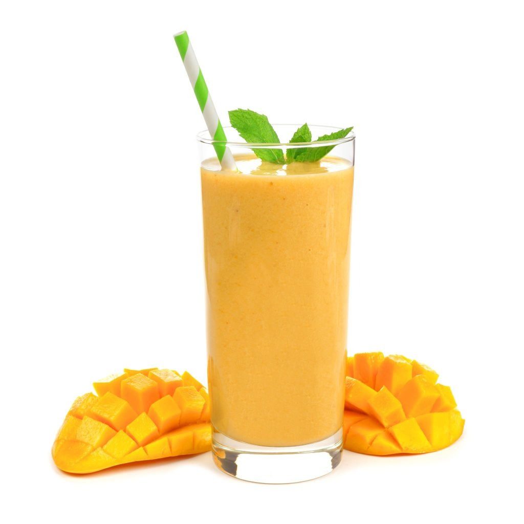 peach smoothie with green and white straw