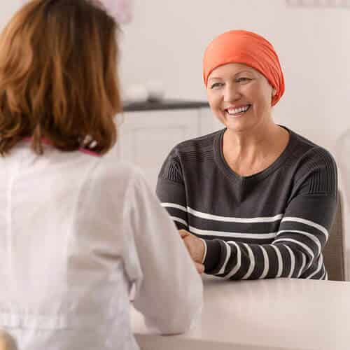 A chemotherapy patient talking to a doctor