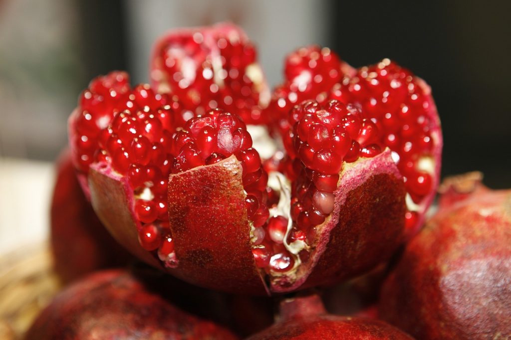 pomegranate seeds in an open pomegranate