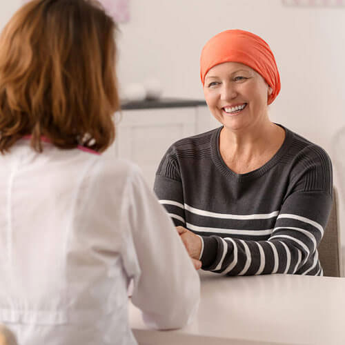 chemo patient smiling at doctor